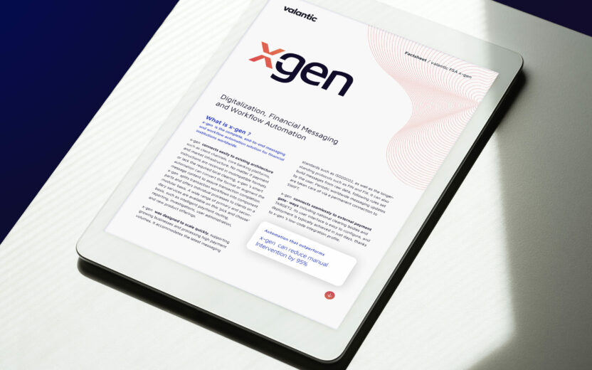 White tablet showing the title page of the x-gen factsheet, positioned on a white table with natural light and shadow