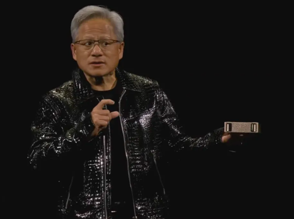 Nvidia CEO Jensen Huang holding the Project Digits computer on stage at Nvidia’s CES 2025 press conference. Image: Nvidia