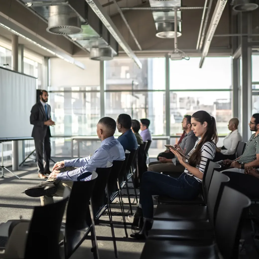 Business people attending a seminar with social distancing