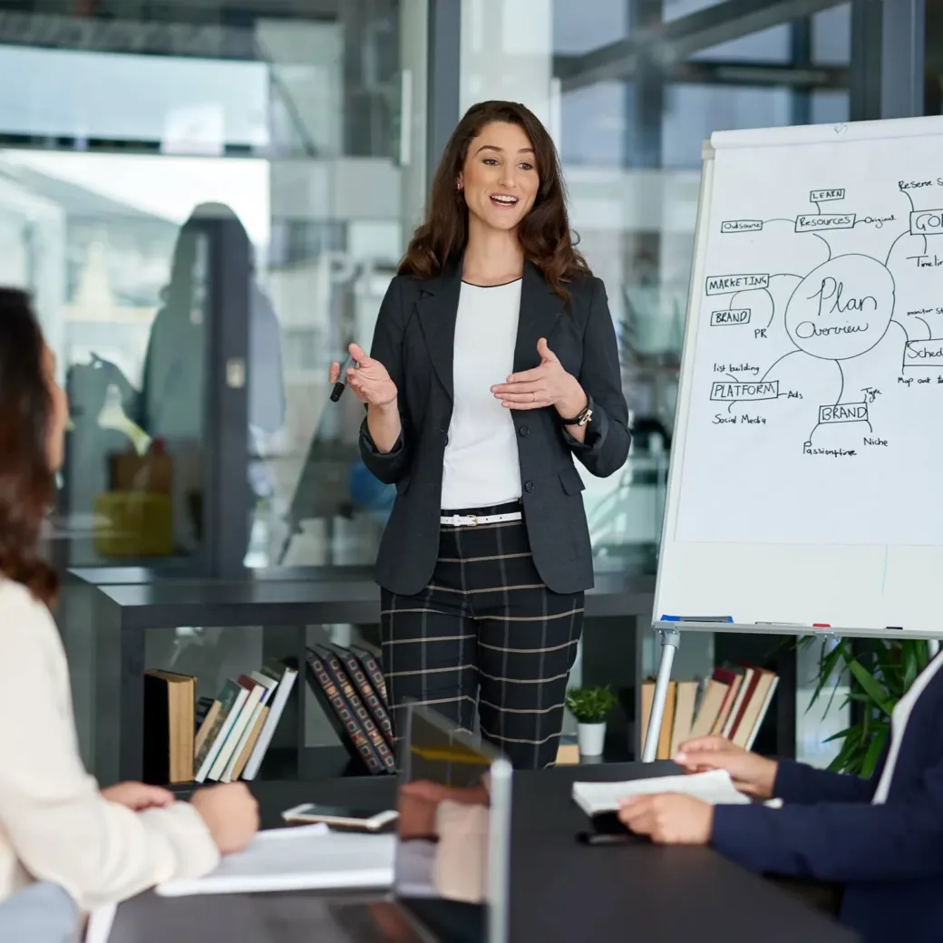 Young businesswoman giving a presentation in the boardroom