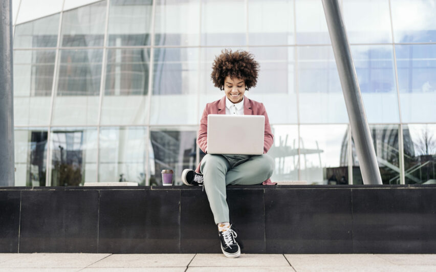 Business Woman Using Laptop Outdoors