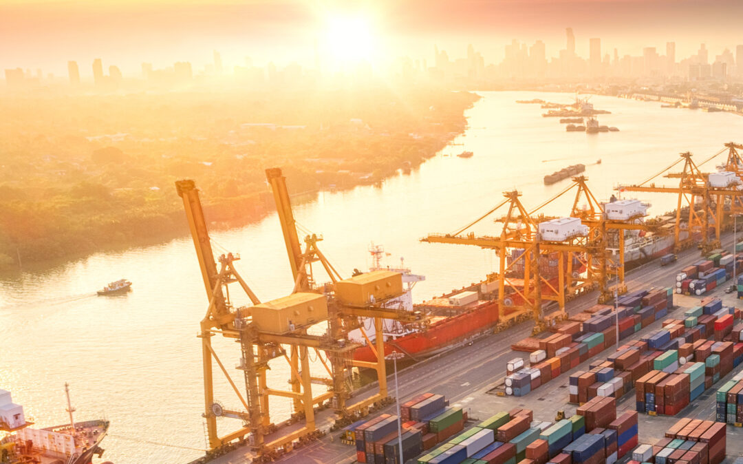 Industrial harbor at sunset, a skyline in the background