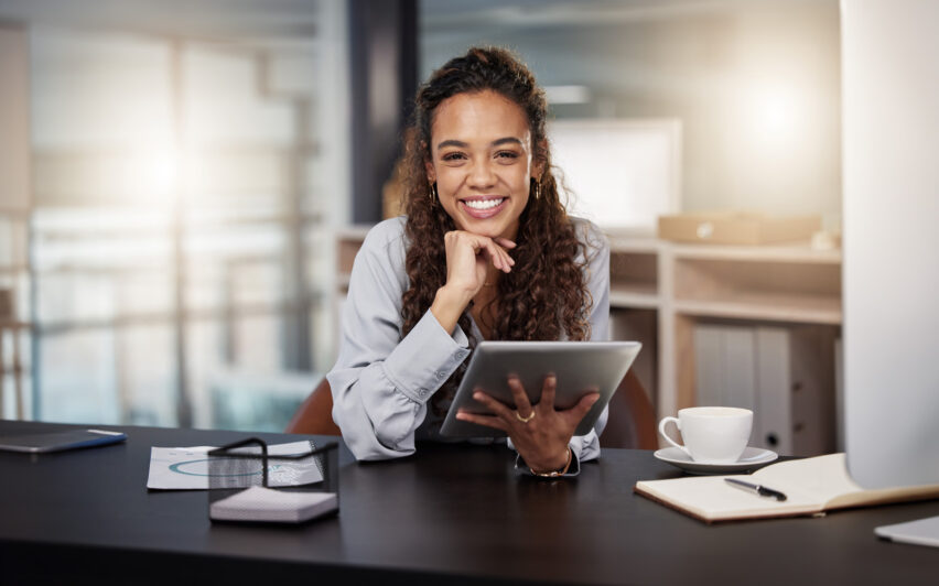 Shot of a young woman using a tablet at work