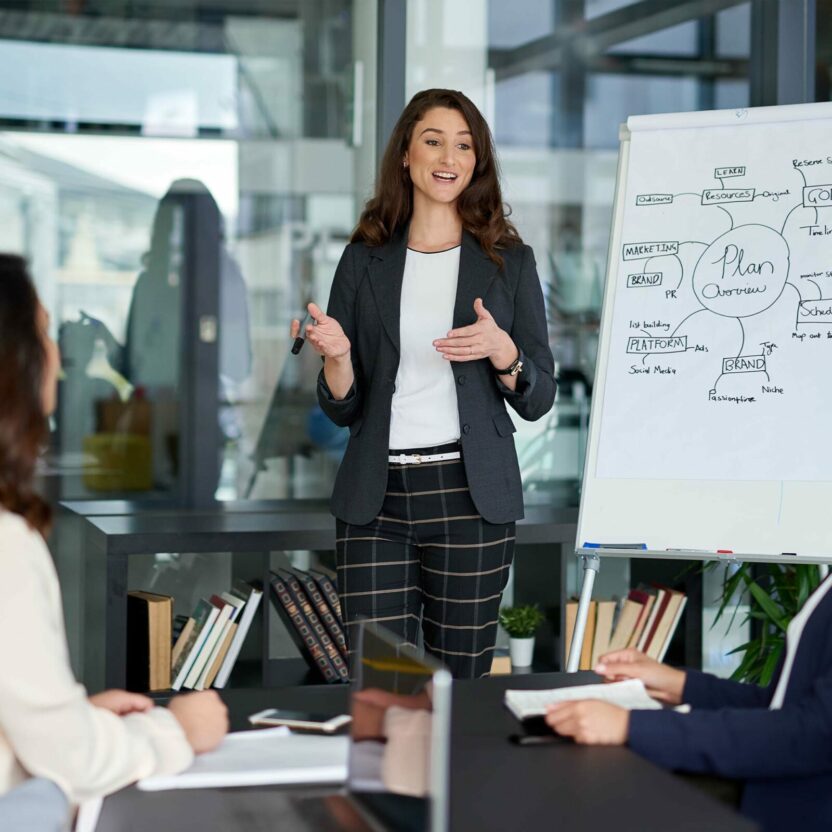 Young businesswoman giving a presentation in the boardroom