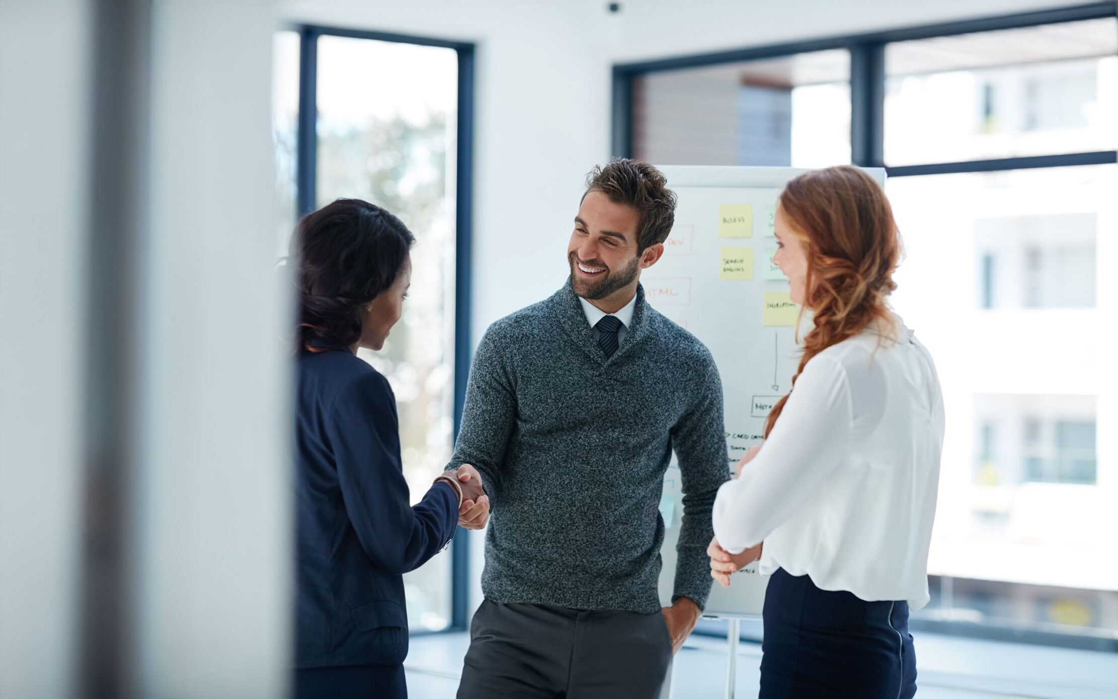 Cropped shot of businesspeople shaking hands in an office