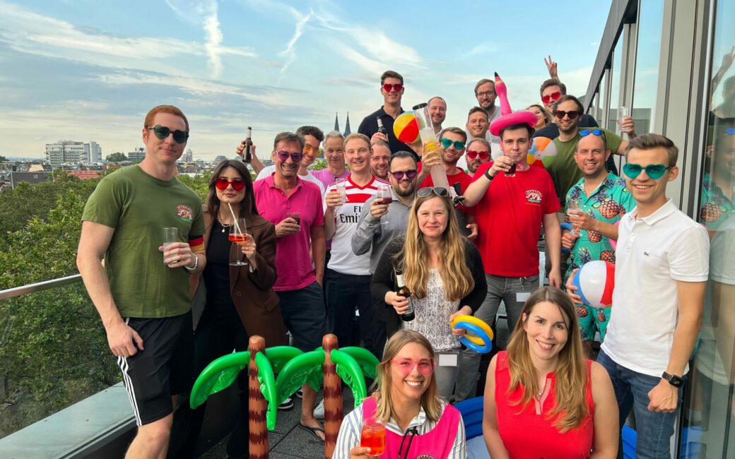 valantic Cologne employees during a Mallorca-themed party on the rooftop terrace of the office