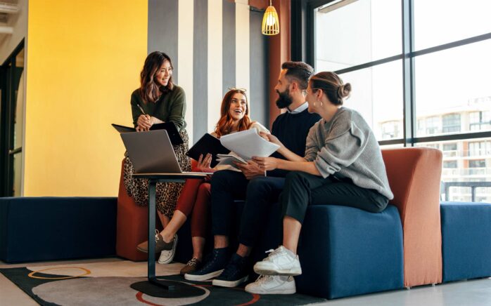 Businesspeople working in an office lobby