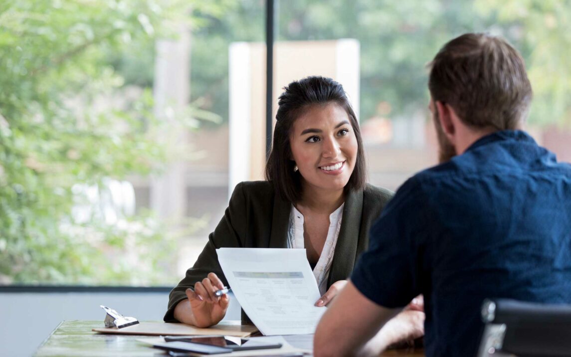 cheerful businesswoman meets with customer