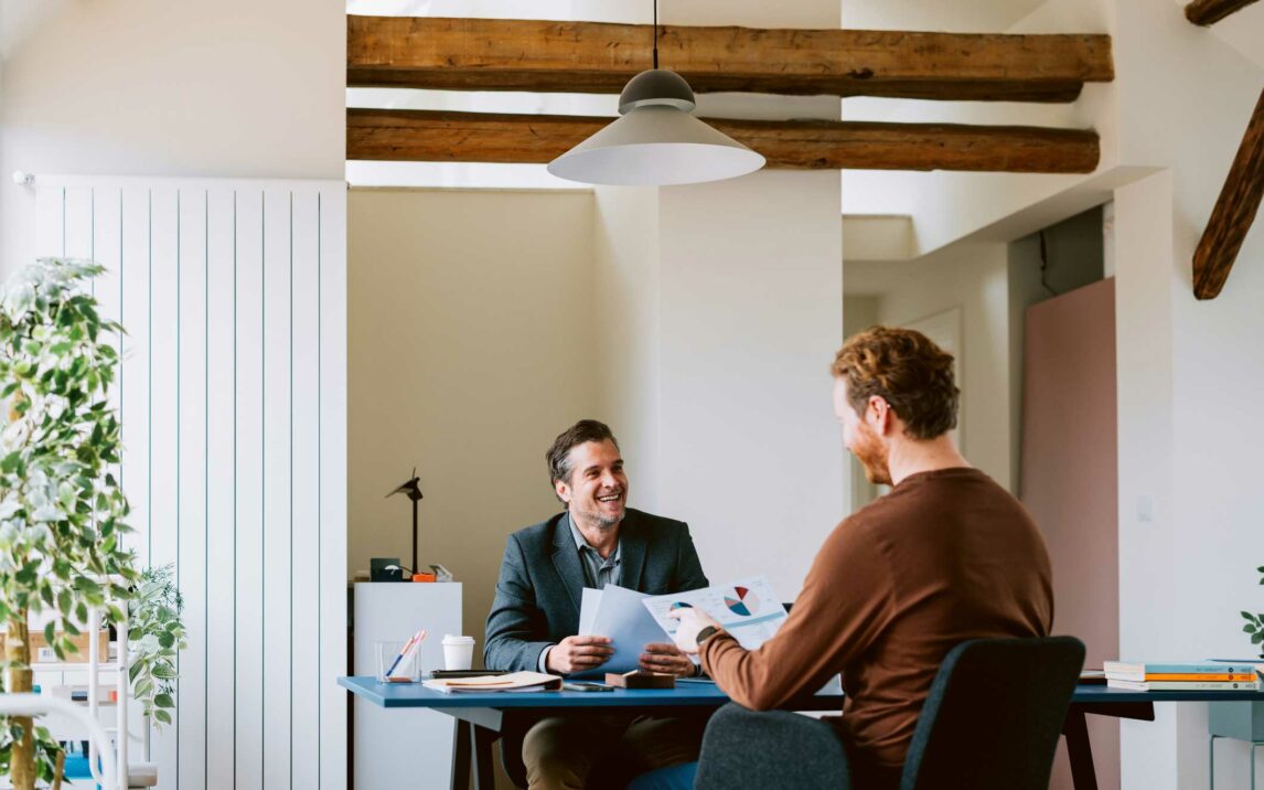 two professionals engaged in a business meeting