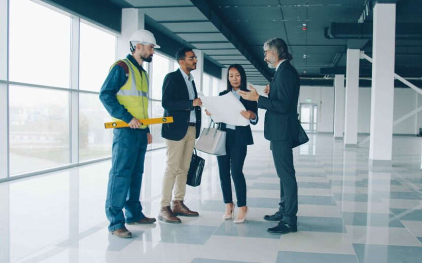 Meeting of a group of business people, discussing construction