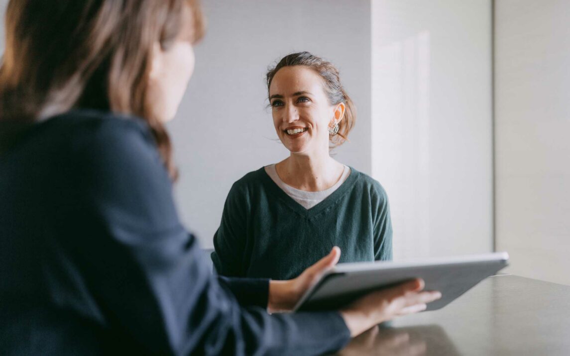 woman meeting female banker for financial advice