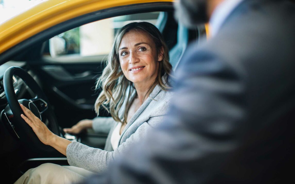 businesswoman looking for a new car