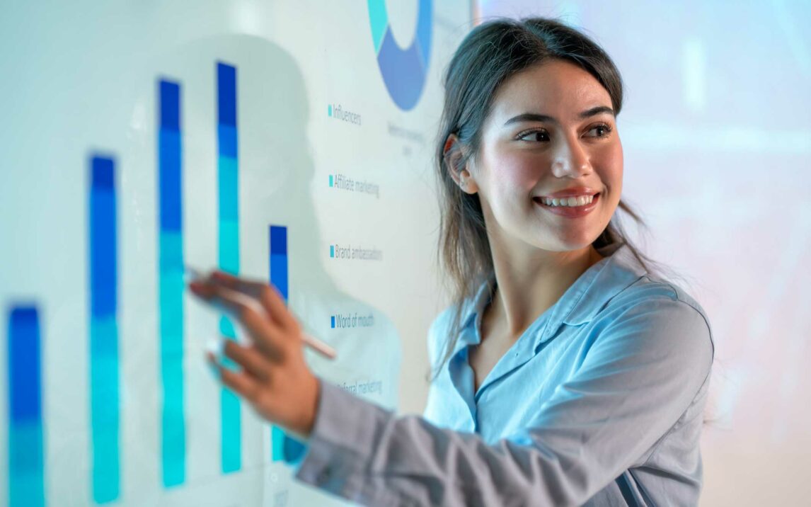 businesswoman leading meeting on graphical screen