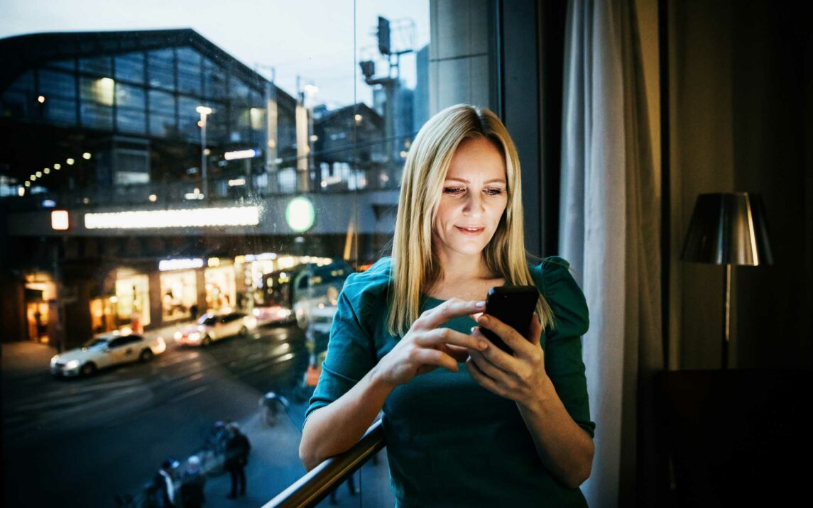 businesswoman networking using her smartphone