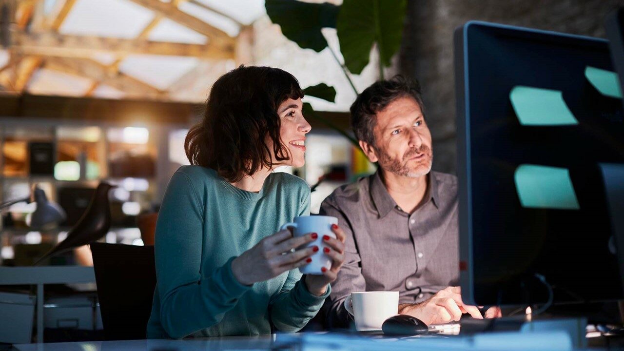 Woman and man looking at the computer together