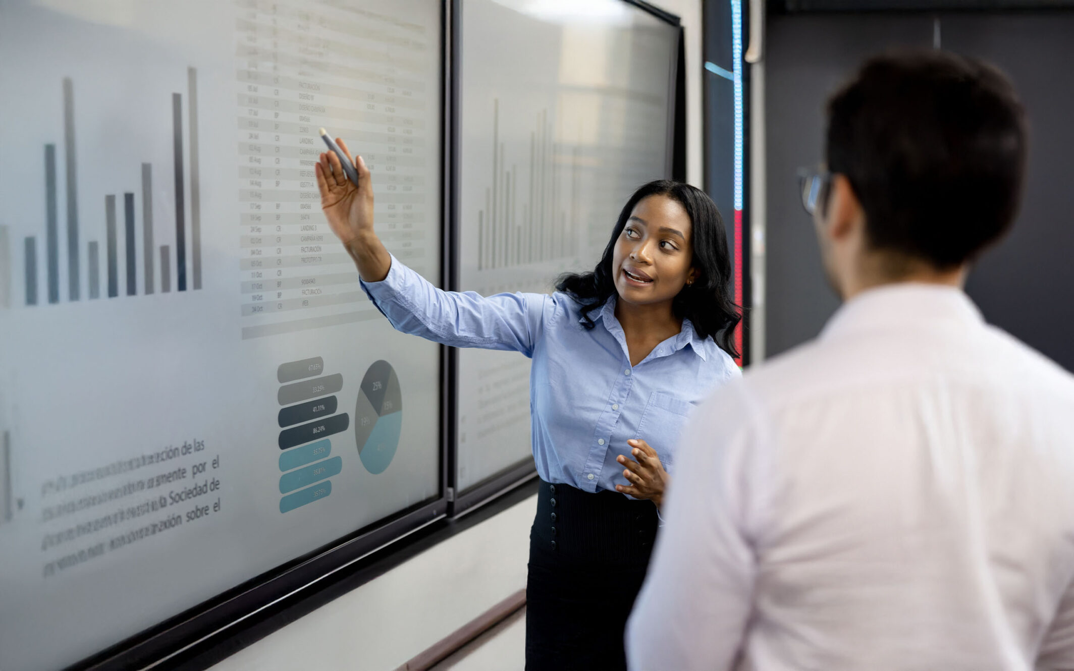 Woman explaining something to colleague