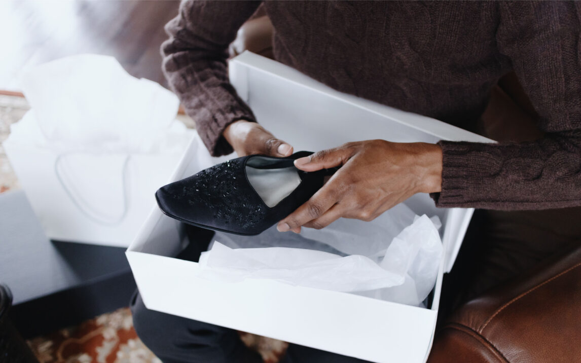 Woman Removes New Dress Shoes From Box