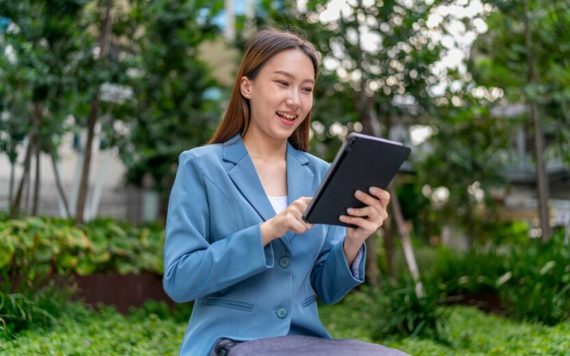 Woman reading an article on an iPad