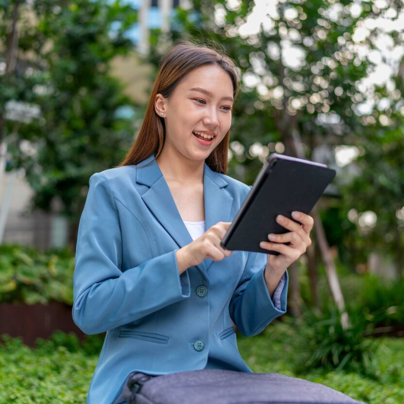 Woman reading an article on an iPad