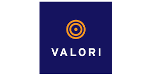 A logo with a dark blue background featuring concentric orange circles above the text "VALORI" in white capital letters, subtly inspired by the OutSystems NextStep Experience.